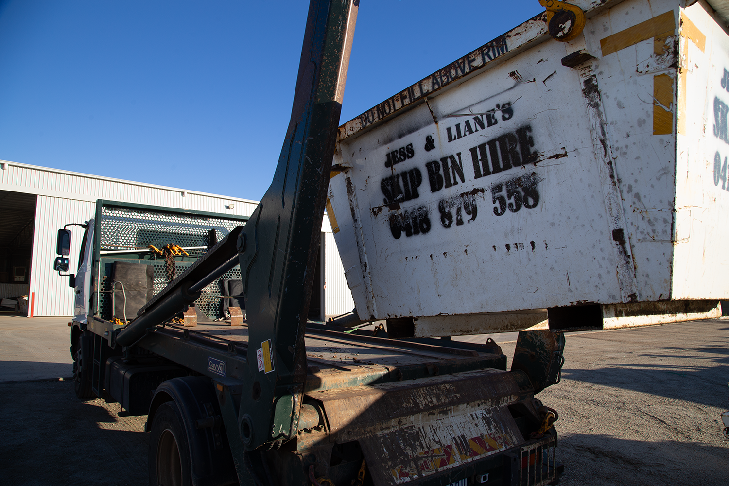 Skip hire truck with skin bin